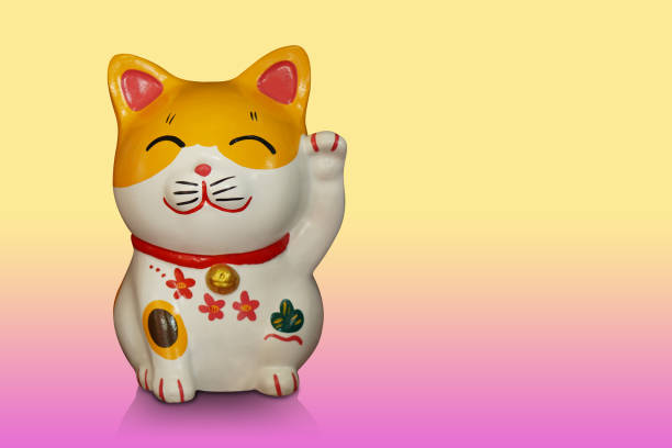 istock front view antique lucky cat on gradient yellow and pink background, object, animal, decoration, statue, copy space 1455894842