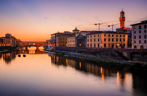 istock Famous Ponte Vecchio bridge and Palazzo Vecchio at sunset, Florence, Italy 1455898239