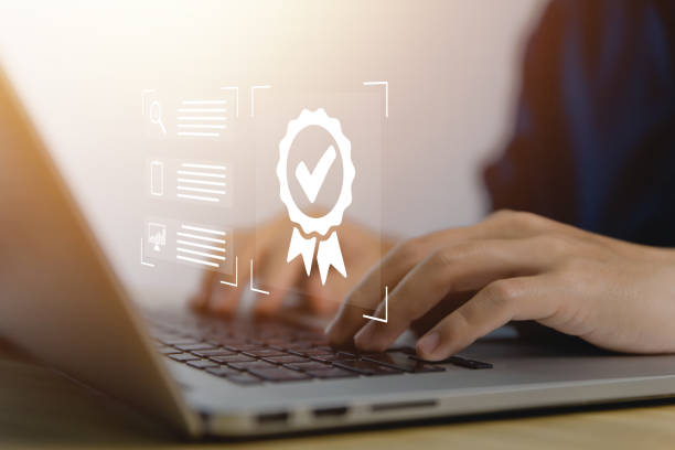 istock Businessman using laptop showing digital technology check icon symbol Industry-leading ISO certification 1455901134