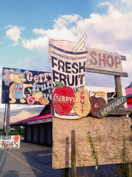 British Columbia, Canada - May 10, 2021: The old wooden shop sign of Gerry's fresh fruit and vegetable market stall in Keremeos, British Columbia, Canada.