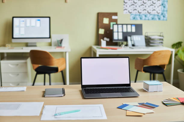 istock Office interior with white screen mock up on desk 1455902510