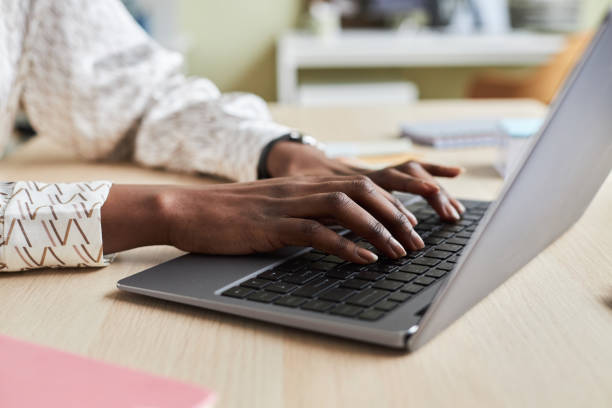 istock Close up of unrecognizable black young woman using laptop 1455902747