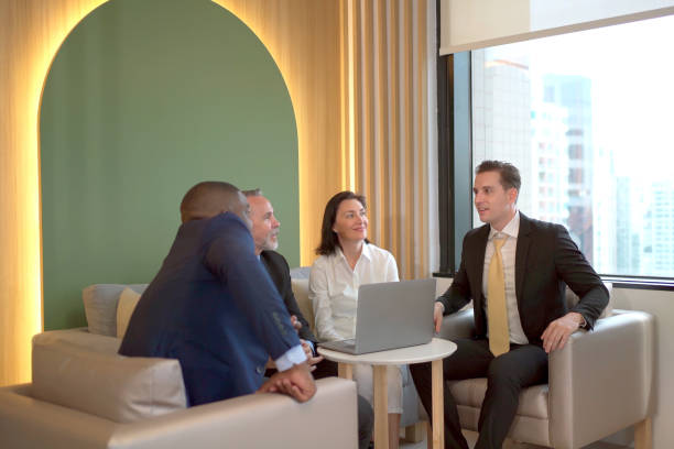 istock Businesspeople team having a discussion. 1455903781