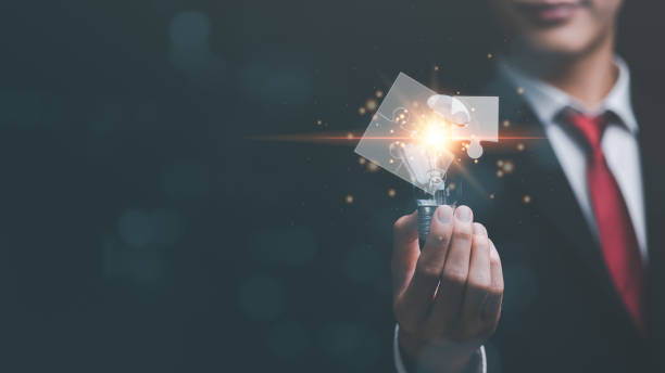 istock solution concept and demonstrating leadership strategies,Creativity that will lead the business in the right direction,with innovation and brain power from brainstorming,man holding a light bulb 1455903997