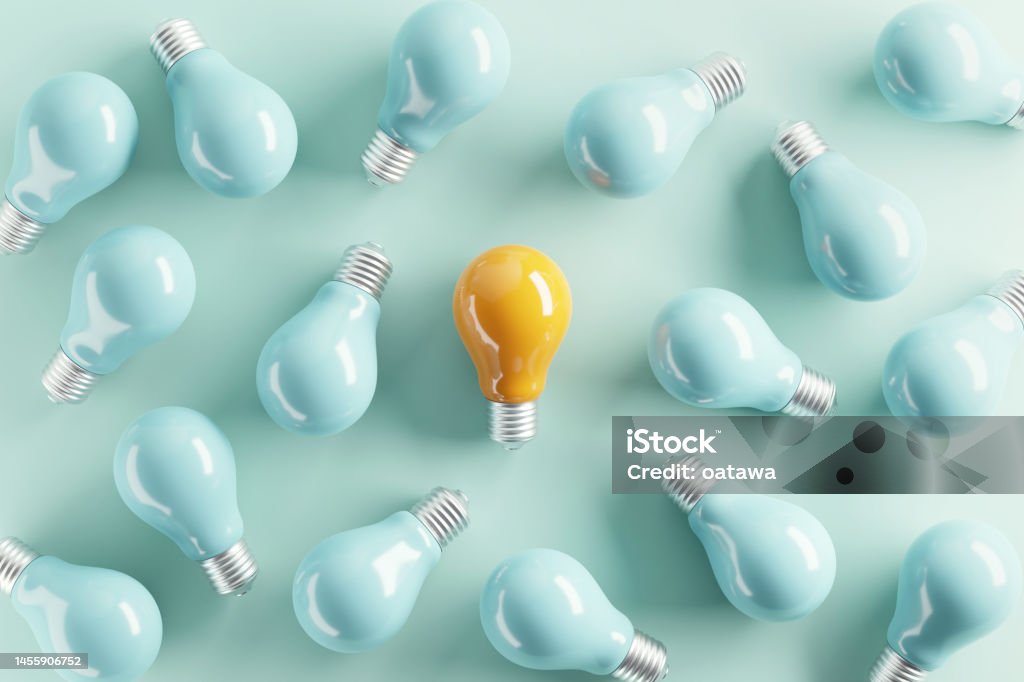 Minimal idea of yellow light bulb surrounded with blue bulbs on pastel background. 3d rendering. Idea creative Concept. Copy space. Individuality Stock Photo