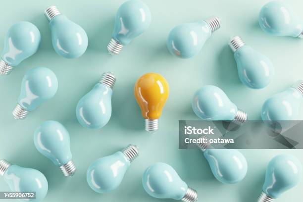 Minimal Idea Of Yellow Light Bulb Surrounded With Blue Bulbs On Pastel Background 3d Rendering Idea Creative Concept Copy Space Stock Photo - Download Image Now