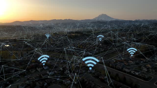 Aerial view of a suburban neighborhood with blue wifi icons popping up and connected webs of data.