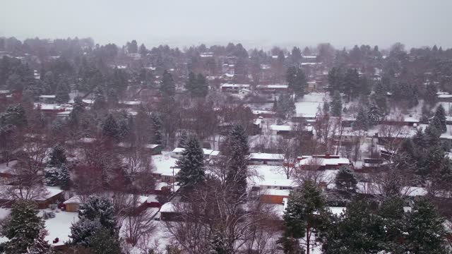 Aerial view of a snow covered neighborhood in middle class America.