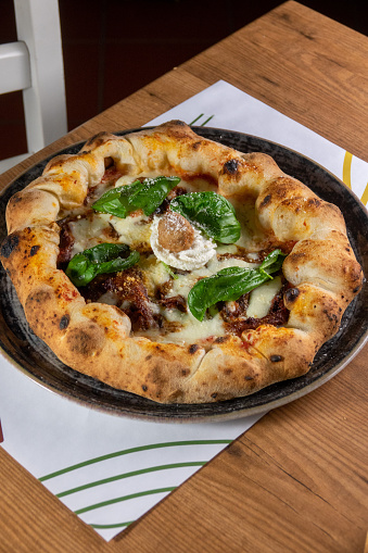 Neapolitan pizza on the table with meat ball