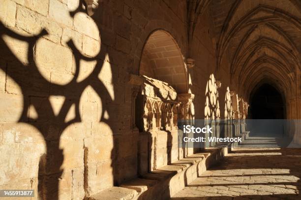 Cloister Of The Fontfroide Abbey With Shadows On The Wall Languedocroussillon France Stock Photo - Download Image Now