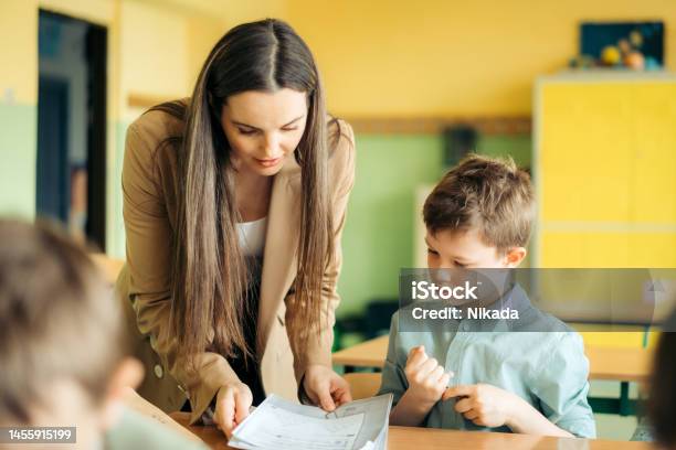 Elementary School Students In Classroom With Teacher Stock Photo - Download Image Now