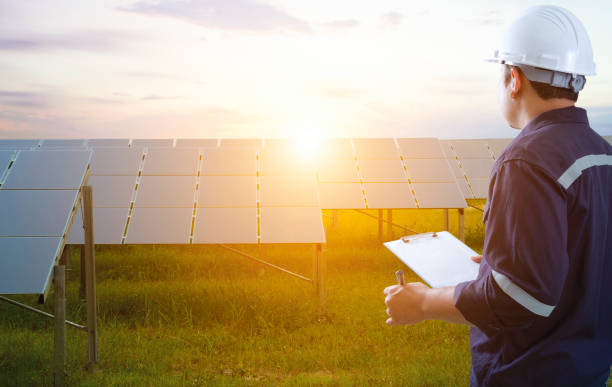 istock Electrical engineers are checking the solar cell farm. 1455916060