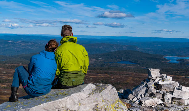 istock Back view of a couple on mountains 1455917890