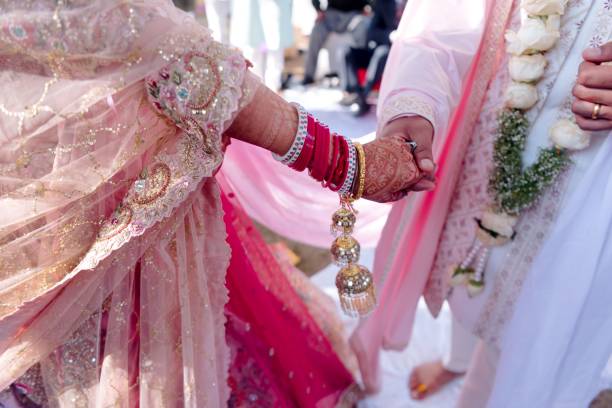 istock Indian lovebirds holding hands 1455920806