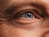 Eye - Macro skin and face detail with wrinkles on mature man