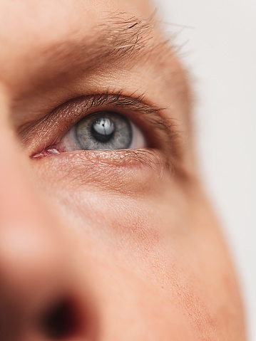 Eye Macro skin and face detail\nPhoto taken in studio of mature adult man in his mid 40s