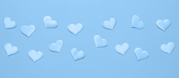 istock Blue border with blue silk hearts, flat lay. Valentine's Day. Banner 1455923640