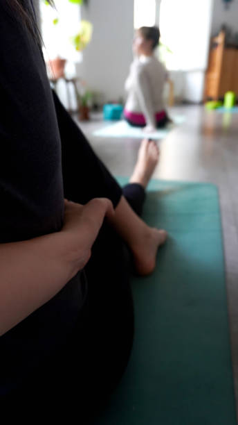 istock Woman stretching in yoga class 1455925735