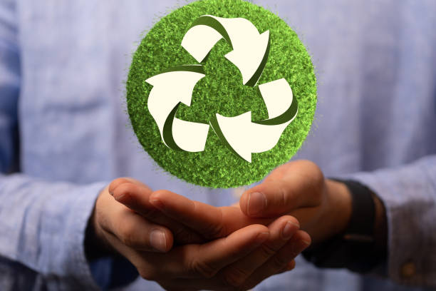 istock Caucasian man hands holding green recycle sign, three arrows 3D 1455926312