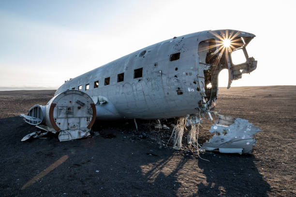 istock Crashed white airplane with its remnants on a lonely, vast field in Iceland 1455927205
