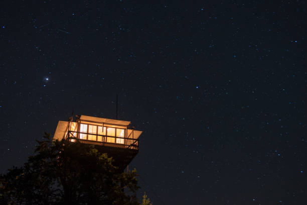 istock Starry night over the house on a tree 1455929125