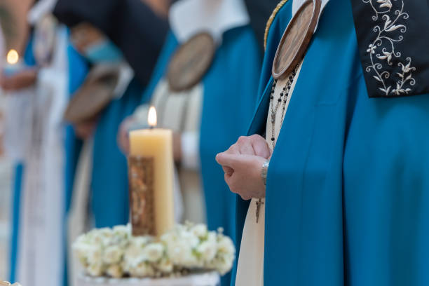 istock Closeup shot of a nun hands praying on catholic ceremony 1455929536
