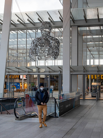 London, United Kingdom – January 02, 2022: A sculpture of human made from letters from different alphabets