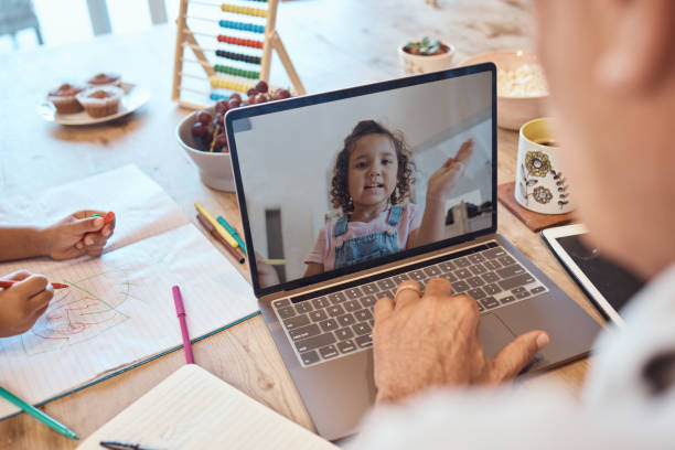 istock Elearning, video call and computer communication of child and teacher talking for online education. Digital student support, technology and man talking on the web for kid development and learning 1455930286