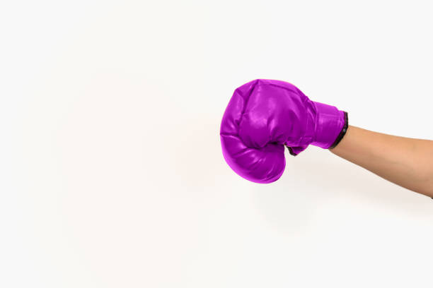 istock purple boxing glove on white background 1455931515