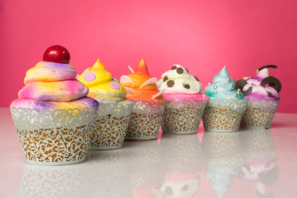 The delicious cupcakes with colorful decorations