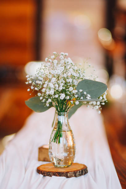 istock Vertical shot of decorative wedding flowers on a table 1455932861