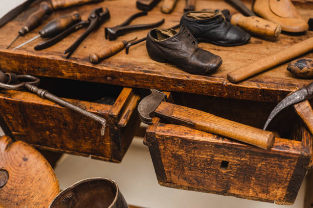 istock Closeup shot of different tools of a cobbler workplace 1455933411