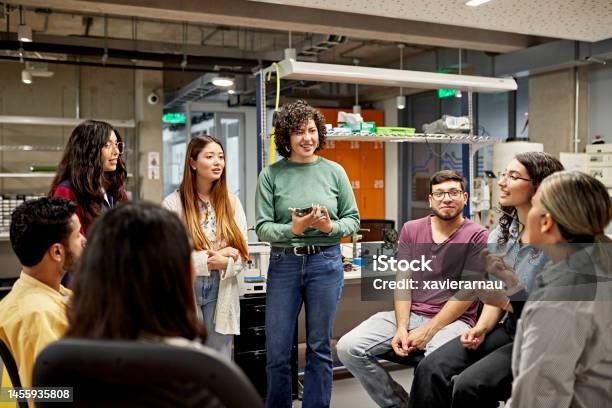 Technical College Students Exchanging Ideas Stock Photo - Download Image Now - Education Training Class, Discussion, Laboratory