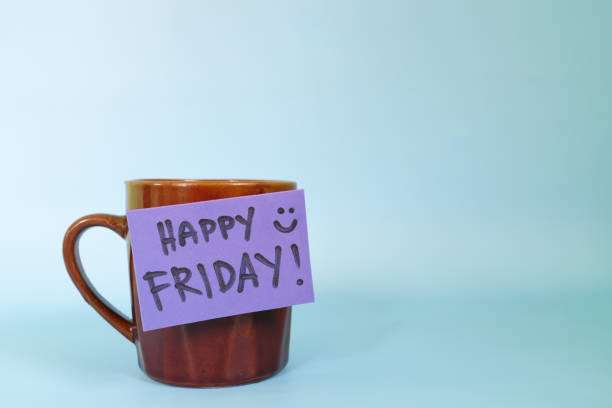istock Welcome, hello and happy Friday concept. Selective focus of coffee cup with written message isolated in blue background 1455935866