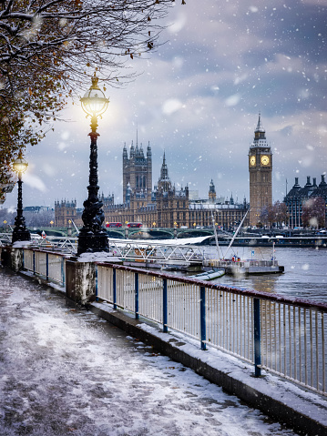 Beautiful winter view of the snow covered Westminster Palace and Big Ben tower in London, England