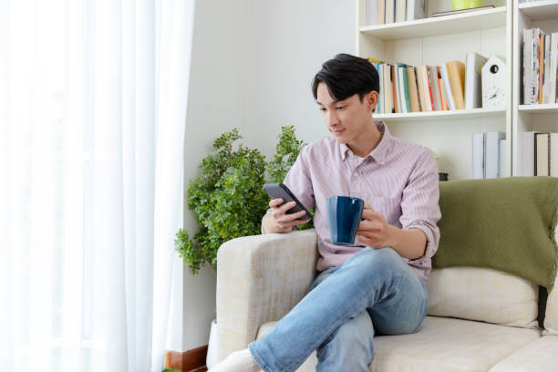 istock Man shopping online at home. 1455938054