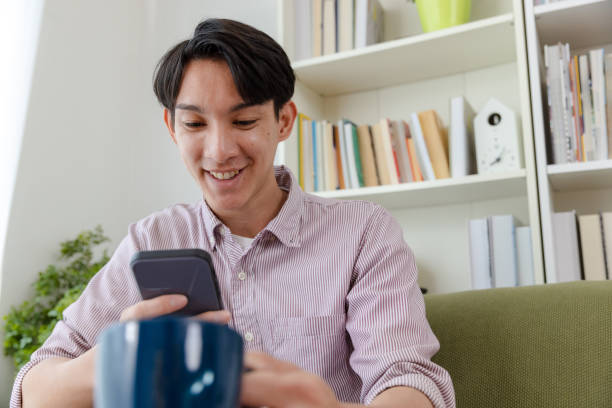 istock Man shopping online at home. 1455938082
