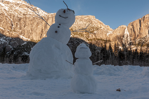 Exterior shot of a Snowman standing in Yosemite valley, on a snowy winter afternoon.