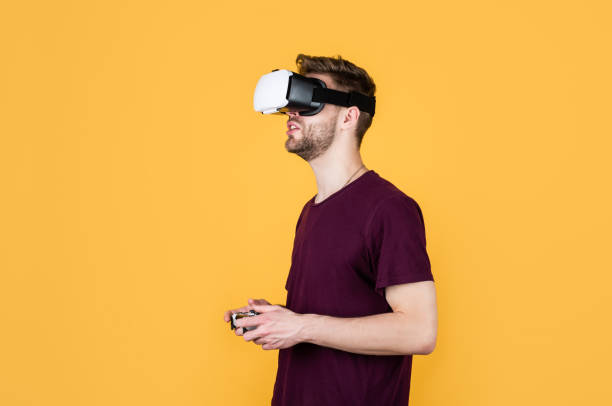 istock Another reality is here. male in VR headset. gamer use modern technology. Digital future and innovation. Visual reality. man in wireless VR glasses. guy play video games. game player with console 1455938853