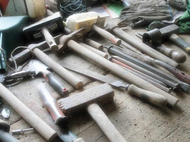 istock work table full of tools, including hammers, files, brushes etc-high lights 1455940508