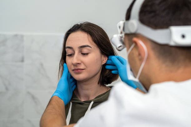 istock woman came for an appointment with a doctor who performs an examination 1455940727