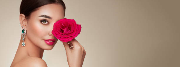Beautiful young woman a rose flower