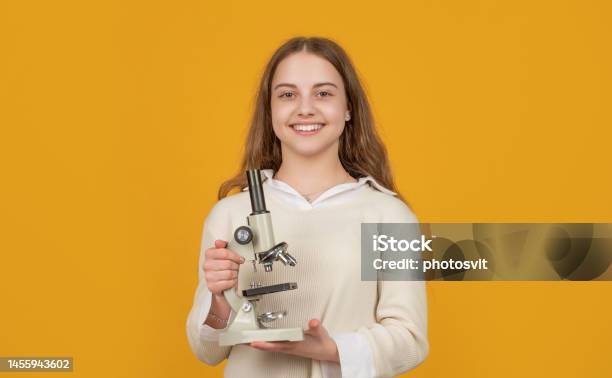 Positive Kid With Microscope On Yellow Background Stock Photo - Download Image Now - High School, STEM - Topic, Back to School