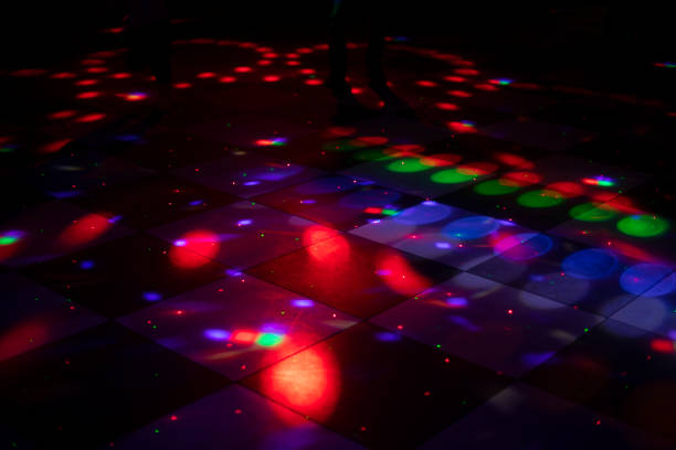 istock Disco dance floor. Light on dance floor. Colored spots on floor. Lights from spotlight. 1455943610