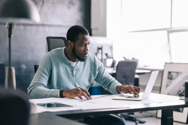 istock The architect uses the laptop to access design software, making adjustments to the blueprints in real-time. 1455943805