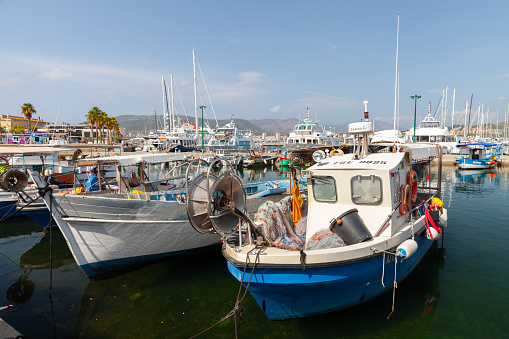 Ajaccio, France - August 25, 2018: Small fishing boats are moored in port of Ajaccio on a sunny day