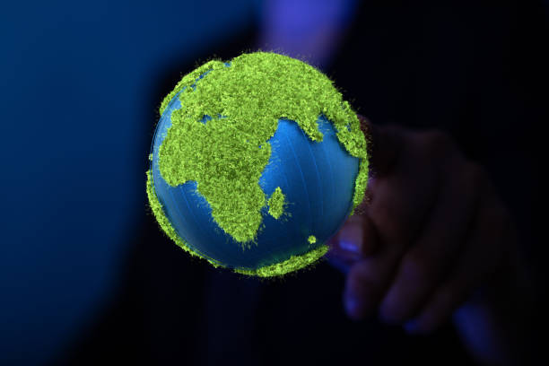 istock Illustration of a hand holding planet earth 1455944574