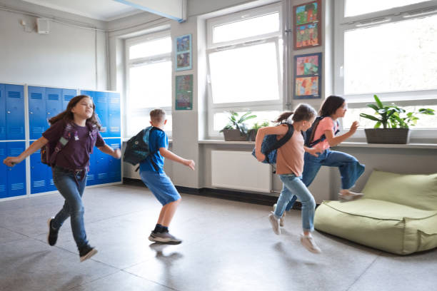 istock School childen runing in the school corridor 1455946239