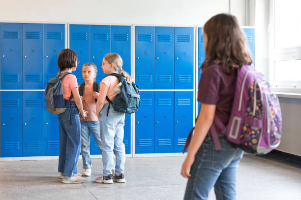 istock School girls standing in the school corridor 1455946764