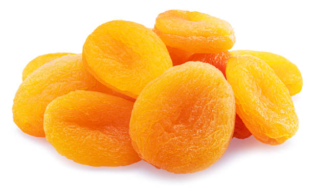 istock Delicious dried apricots isolated on white background. Macro shot. 1455947719